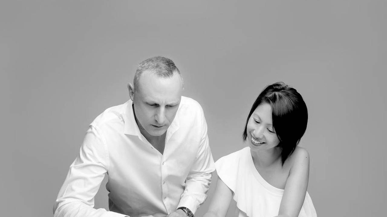 Jason Byron and Amy Tang reviewing a property development plan